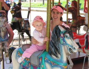 siena riding in boston common carousel