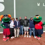 People near Fenway Park with Red Sox animators